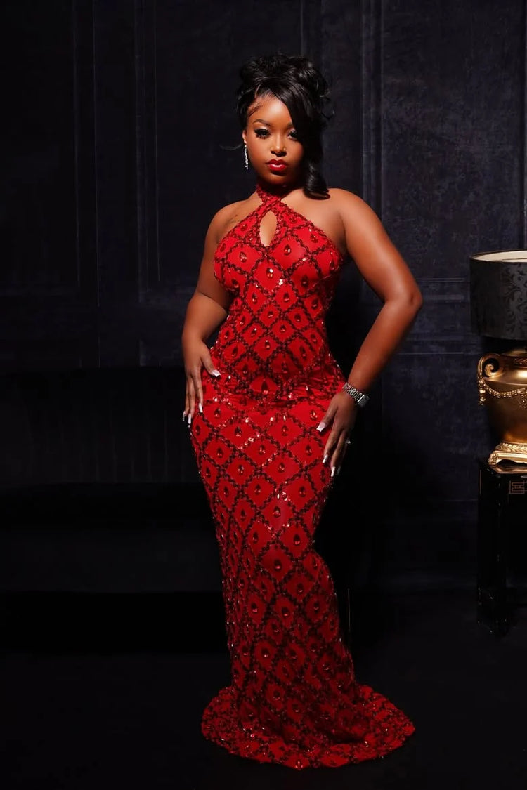 Yembi Fashion red crystal halter dress with criss-cross neckline, central chest keyhole cutout, sheer red mesh, and geometric diamond grid pattern of ruby rhinestones