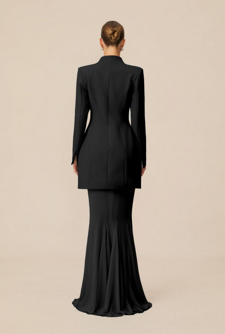 Yembi Fashion luxury black blazer mermaid gown featuring a structured tuxedo jacket bodice and a dramatic sheer pleated mermaid train skirt