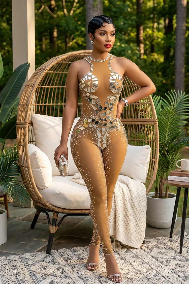 Yembi Fashion luxury silver mirror jumpsuit featuring an architectural pattern of reflective silver mirror shards and scattered crystals on a nude illusion halter neck catsuit