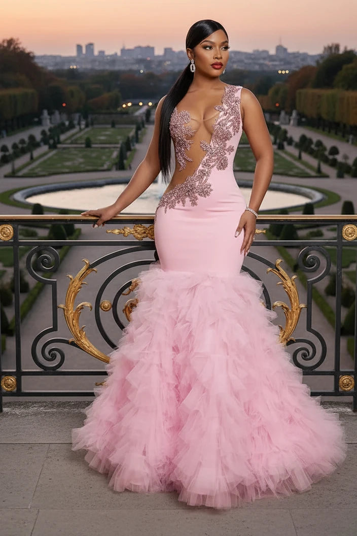 Yembi Fashion pink ruffled mermaid dress with asymmetric bodice, sheer nude-illusion mesh, baroque rhinestone embroidery, and layered tulle skirt