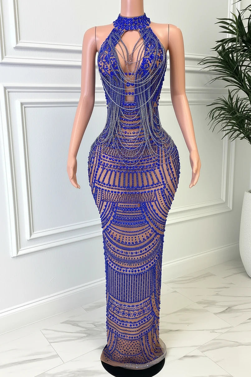 Yembi Fashion royal blue rhinestone maxi dress with nude illusion mesh, embellished halter neck, and layered metallic body chains