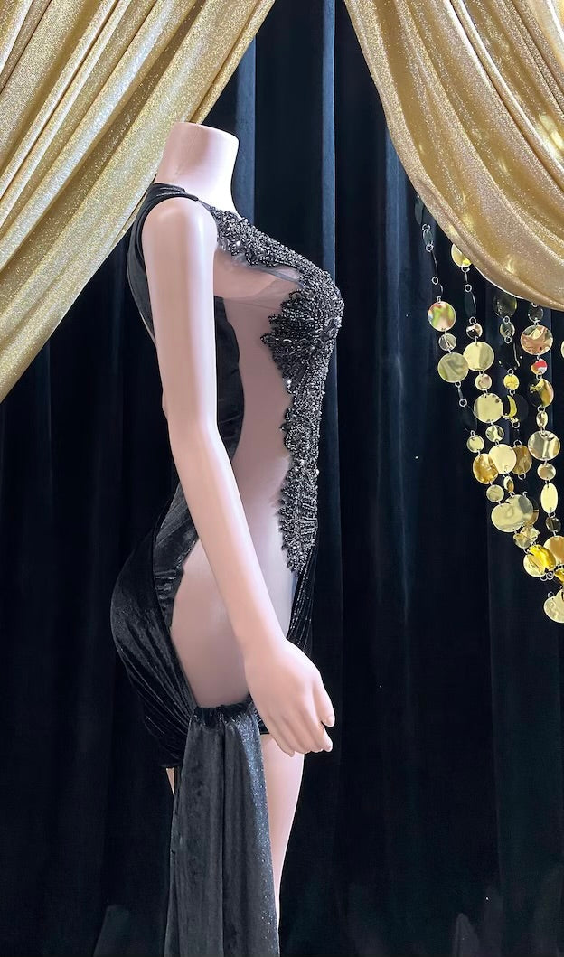 an elegant black midi cocktail dress, showcasing a sophisticated look perfect for formal occasions or cocktail parties