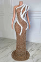 Yembi Fashion white rhinestone maxi dress with asymmetric one shoulder neckline, sheer nude illusion mesh, silver crystals, and bold white ruffled tulle trim