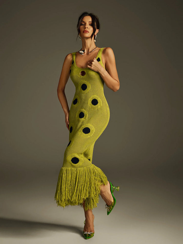 Yembi Fashion luxury olive green polka dot knit maxi dress featuring a chartreuse crochet sleeveless silhouette with black polka dots, center cutout, and a long fringe hem