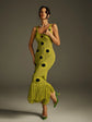 Yembi Fashion luxury olive green polka dot knit maxi dress featuring a chartreuse crochet sleeveless silhouette with black polka dots, center cutout, and a long fringe hem