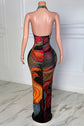 Yembi Fashion multicolor crystal maxi dress with plunging halter neck, sheer nude illusion mesh, and abstract swirling patterns of rainbow rhinestones