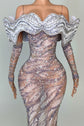Yembi Fashion crystal embellished mermaid gown with nude illusion rhinestone mesh, sculptural ruffled wing collar, and matching embellished gloves