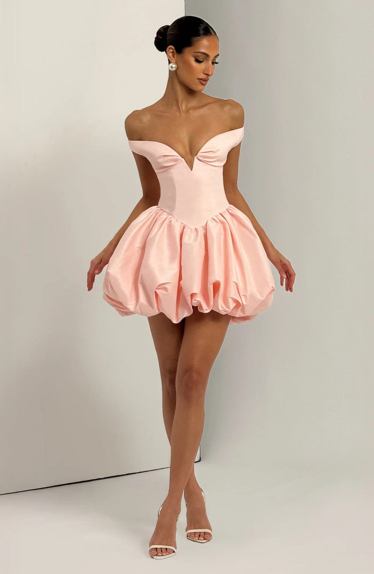 Yembi Fashion luxury pink off-the-shoulder puff mini dress featuring a structured corset bodice with a plunging V-neckline and dramatic bubble skirt