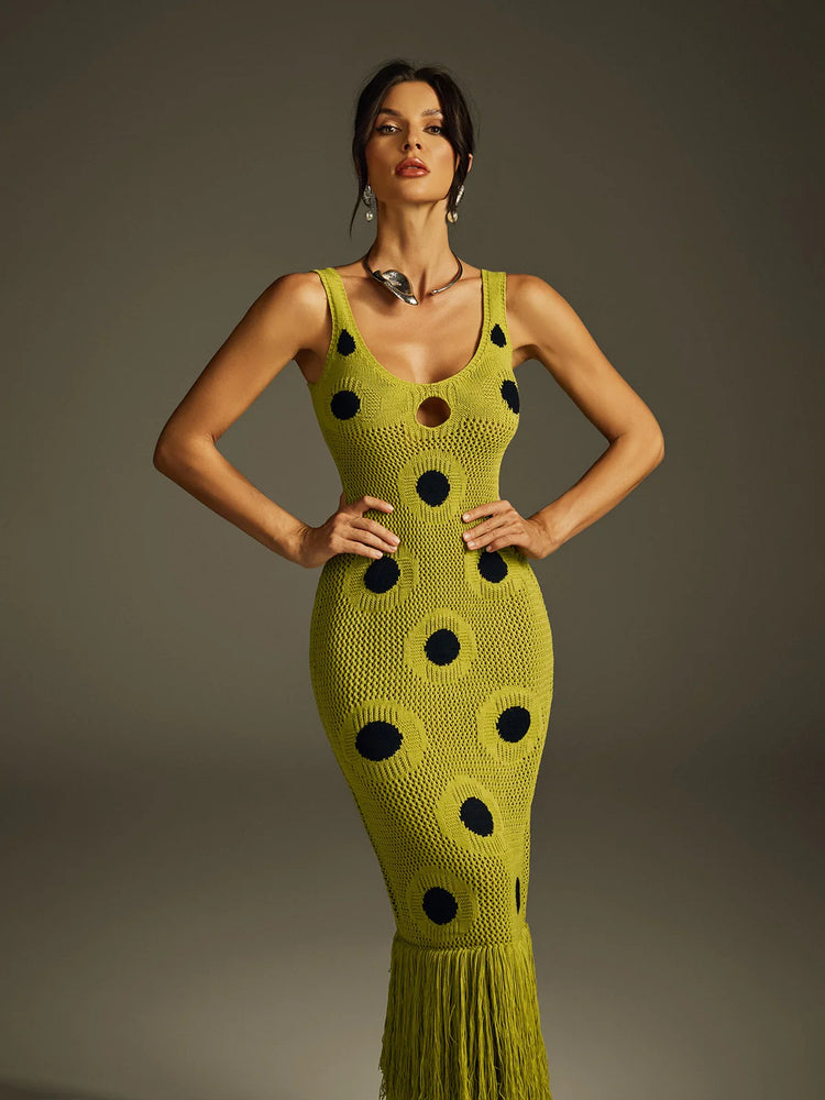Yembi Fashion luxury olive green polka dot knit maxi dress featuring a chartreuse crochet sleeveless silhouette with black polka dots, center cutout, and a long fringe hem