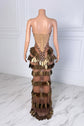 Yembi Fashion gold crystal maxi dress with strapless sweetheart neckline, sheer nude illusion mesh, amber rhinestone bodice, and tiered rows of metallic gold leaf scales