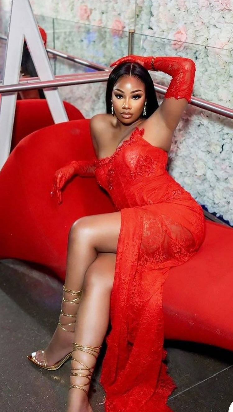 Yembi Fashion red lace maxi dress with strapless corset bodice, tone-on-tone ruby crystal embellishments, dramatic side draping, and matching opera lace gloves