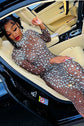 Yembi Fashion heavy crystal embellished nude illusion gown with high mock neck and dense constellation of oversized silver rhinestones on caramel mesh