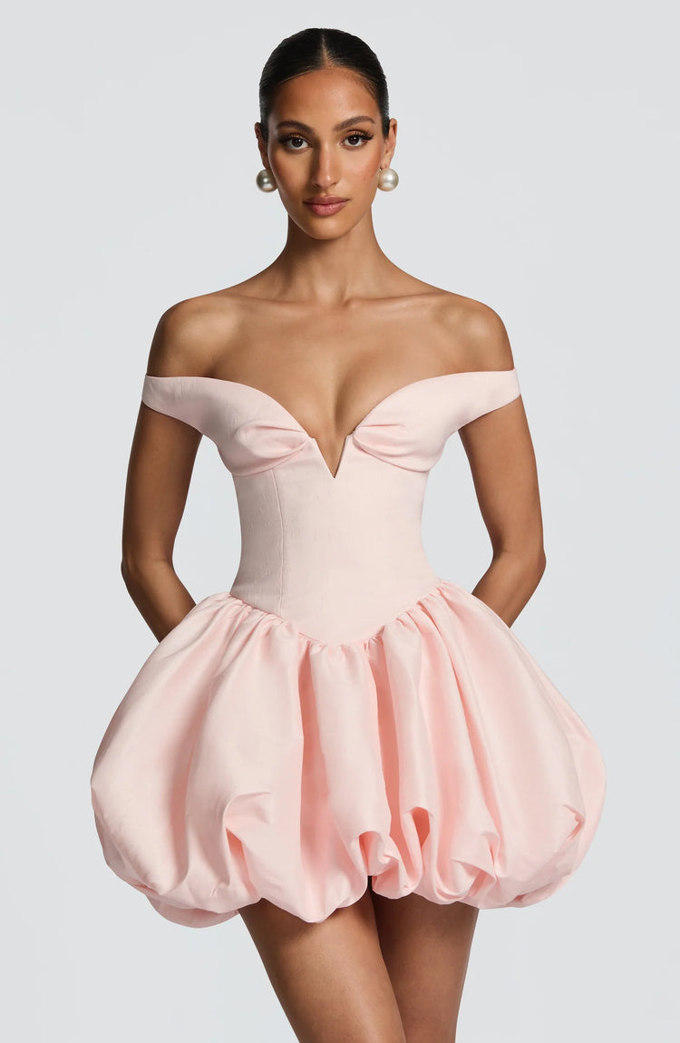 Yembi Fashion luxury pink off-the-shoulder puff mini dress featuring a structured corset bodice with a plunging V-neckline and dramatic bubble skirt