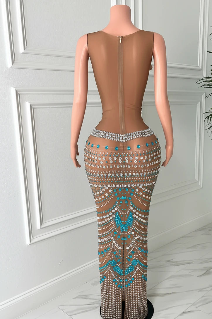 Yembi Fashion turquoise crystal maxi dress with round neckline, sleeveless sheer beige mesh, and geometric scalloped patterns of aqua and silver rhinestones