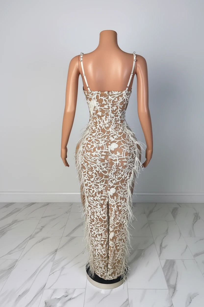 Yembi Fashion feather crystal maxi dress with thin pearl straps, sheer nude illusion mesh, white floral rhinestone embroidery, and side ostrich feathers