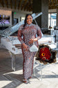 Yembi Fashion heavy crystal embellished nude illusion gown with high mock neck and dense constellation of oversized silver rhinestones on caramel mesh