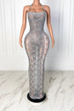 Yembi Fashion silver rhinestone maxi dress with halter neckline, sheer nude illusion mesh, vertical crystal lines, and layered hanging rhinestone fringe strands