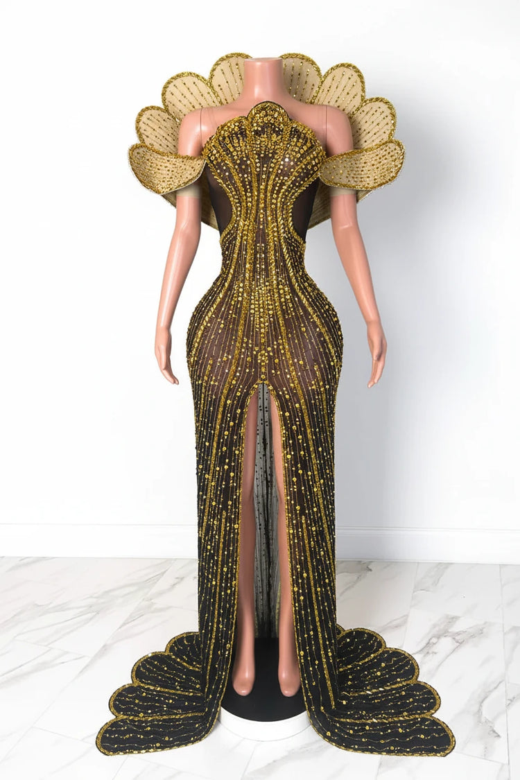 Yembi Fashion gold crystal maxi dress with structured avant-garde fan collar, sheer black nude illusion mesh, and vertical rhinestone linear lines with high slit