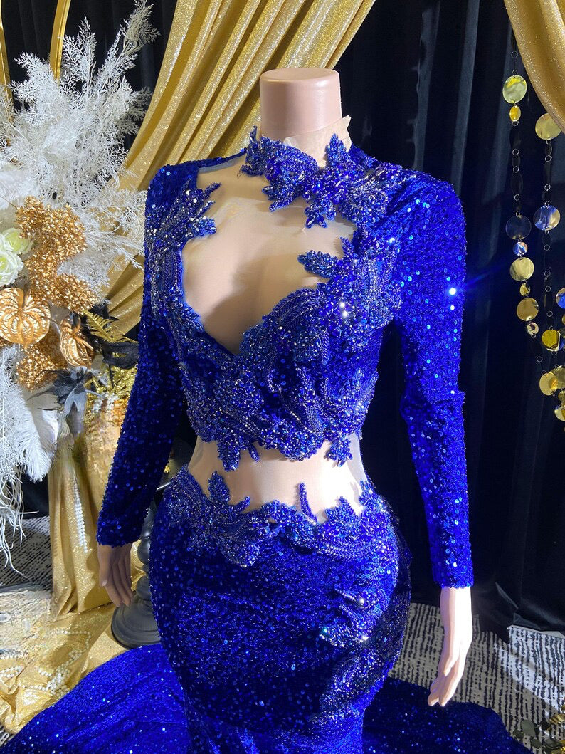 Royal blue evening dress with intricate rhinestone detailing and sparkling crystal embellishments.

Let me know if you&