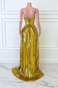 Yembi Fashion gold feather maxi dress with plunging neckline, sheer nude illusion mesh cutout, silver rhinestone crystal belt, and high thigh slit