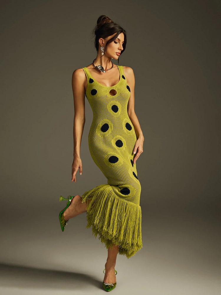 Yembi Fashion luxury olive green polka dot knit maxi dress featuring a chartreuse crochet sleeveless silhouette with black polka dots, center cutout, and a long fringe hem