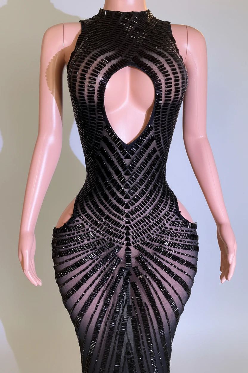 Yembi Fashion black rhinestone maxi dress with high neck, central chest keyhole cutout, sheer nude illusion mesh, and side hip cutouts