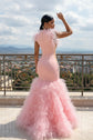 Yembi Fashion pink ruffled mermaid dress with asymmetric bodice, sheer nude-illusion mesh, baroque rhinestone embroidery, and layered tulle skirt