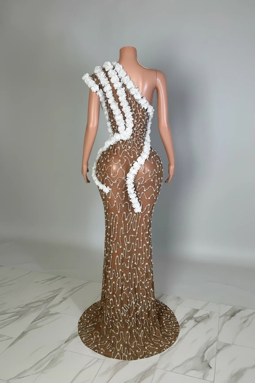 Yembi Fashion white rhinestone maxi dress with asymmetric one shoulder neckline, sheer nude illusion mesh, silver crystals, and bold white ruffled tulle trim
