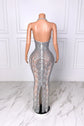 Yembi Fashion silver rhinestone maxi dress with halter neckline, sheer nude illusion mesh, vertical crystal lines, and layered hanging rhinestone fringe strands