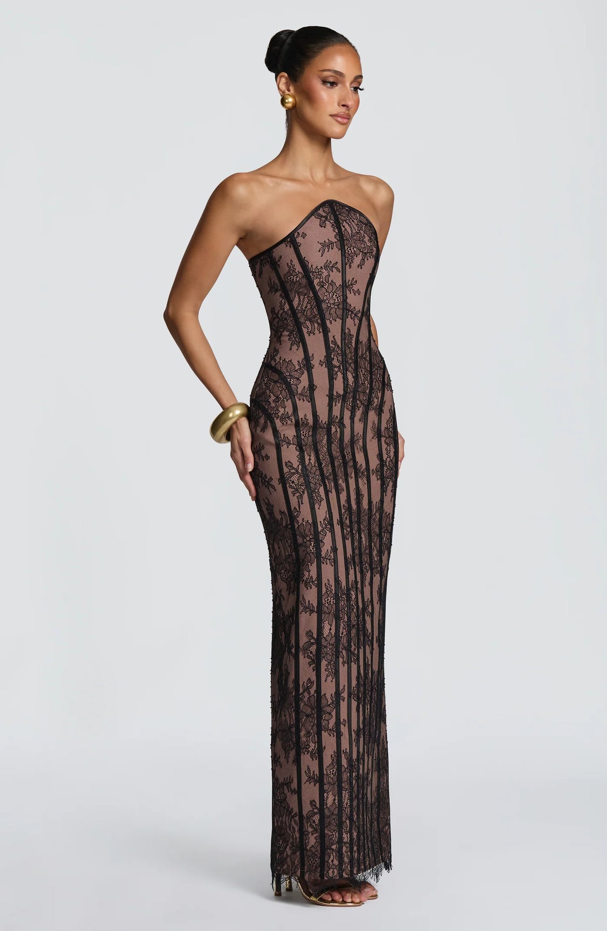 Yembi Fashion luxury black lace maxi gown featuring a strapless structural corset bodice with vertical black velvet panelled lines over a warm nude lining