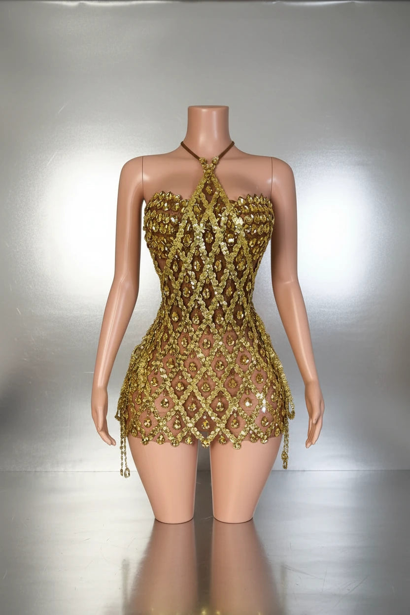 Yembi Fashion gold crystal mini dress with backless mesh cage design, geometric diamond sequin pattern, and hanging crystal fringe