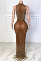 Yembi Fashion brown crystal maxi dress with high mock neck, sheer brown illusion mesh, silver rhinestones, shoulder chains, and tiered rhinestone fringe