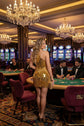 Yembi Fashion gold mirror mini dress with high halter neck, geometric shattered glass mirror pieces, and white pearl embellishments