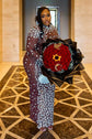 Yembi Fashion heavy crystal embellished nude illusion gown with high mock neck and dense constellation of oversized silver rhinestones on caramel mesh