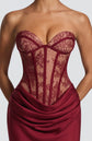 Yembi Fashion luxury red strapless maxi gown featuring a structured corset bodice and a dramatic draped basque waist skirt