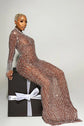 Yembi Fashion nude illusion crystal gown with sheer brown mesh, vertical wavy silver rhinestone patterns, and hanging crystal fringe cuffs