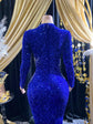 Royal blue evening dress with intricate rhinestone detailing and sparkling crystal embellishments.

Let me know if you&