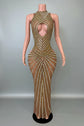 Yembi Fashion gold rhinestone maxi dress with dramatic chest and hip cutouts, high neck, and vertical gold crystal line detailing