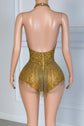 Yembi Fashion luxury gold rhinestone fringe bodysuit featuring a sparkly crystal halter bodice with a plunging deep V-neckline and cascading metallic fringe chains