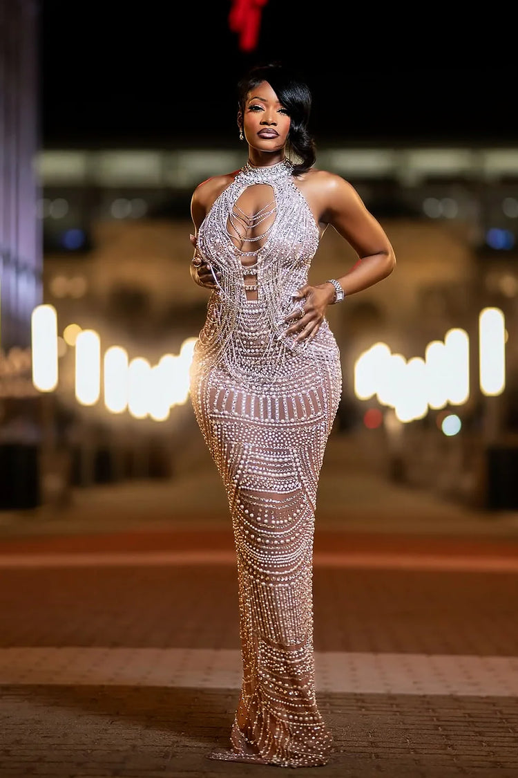 Yembi Fashion silver rhinestone maxi dress with high neck choker collar, plunging cutout bodice, draped chest chains, and sheer nude illusion mesh