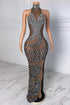 Yembi Fashion silver rhinestone maxi dress with high halter neck, sheer brown nude illusion mesh, vertical wavy crystal patterns, and high thigh slit