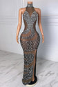 Yembi Fashion silver rhinestone maxi dress with high halter neck, sheer brown nude illusion mesh, vertical wavy crystal patterns, and high thigh slit