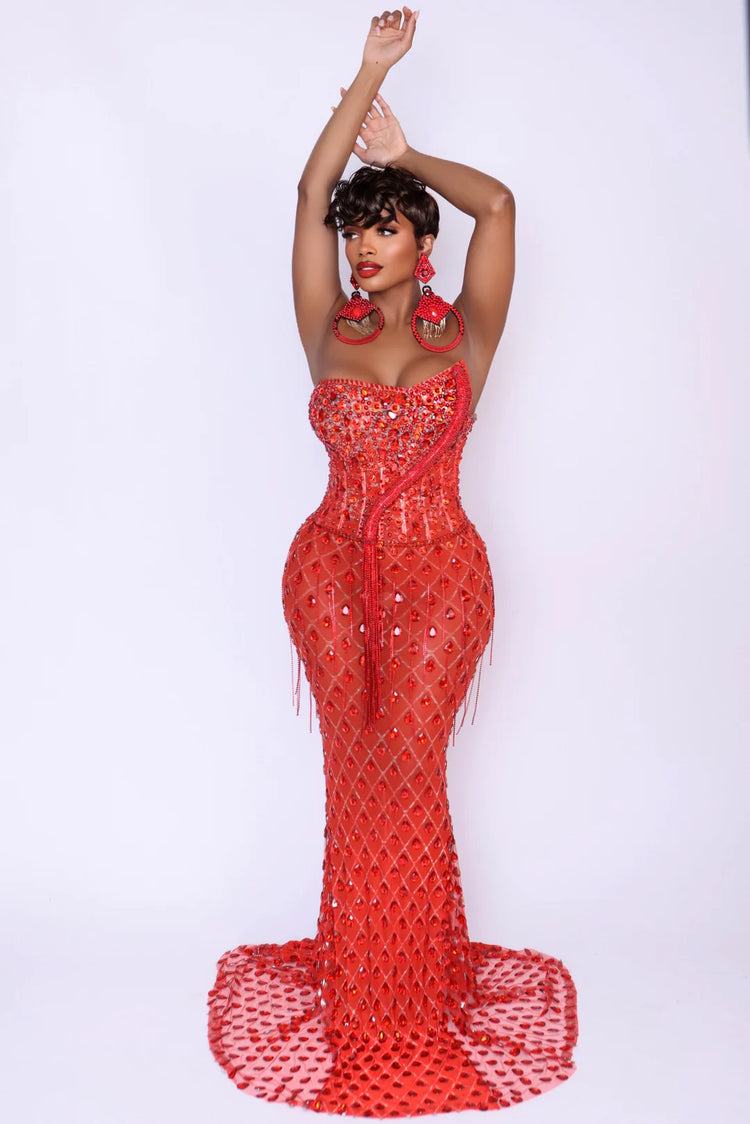 Yembi Fashion red rhinestone mermaid gown with strapless corset bodice, sheer nude-illusion mesh, and heavy geometric crystal lattice beading