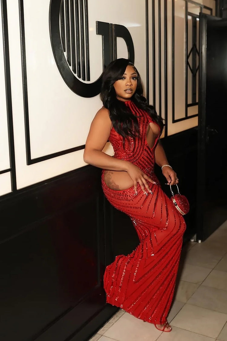 Yembi Fashion red rhinestone maxi dress with dramatic chest and hip cutouts, high neck, and vertical crystal line detailing