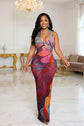 Yembi Fashion multicolor crystal maxi dress with plunging halter neck, sheer nude illusion mesh, and abstract swirling patterns of rainbow rhinestones