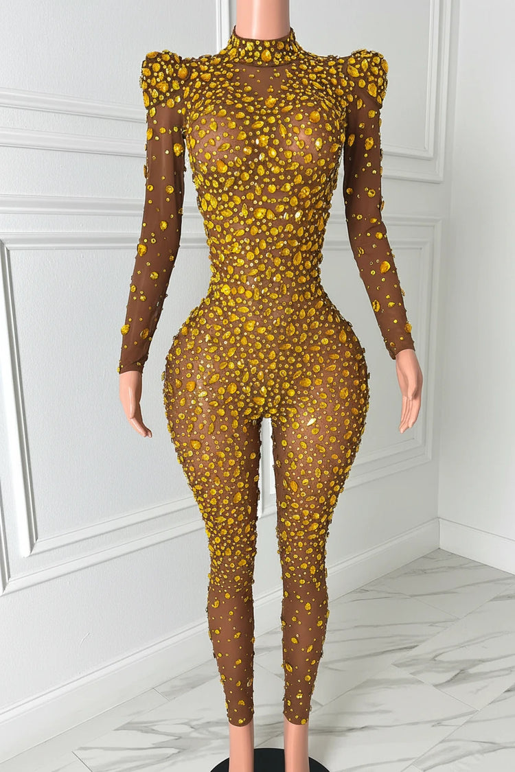 Yembi Fashion gold rhinestone jumpsuit with nude illusion mesh, high mock neck, and structured puff shoulders adorned with yellow crystals