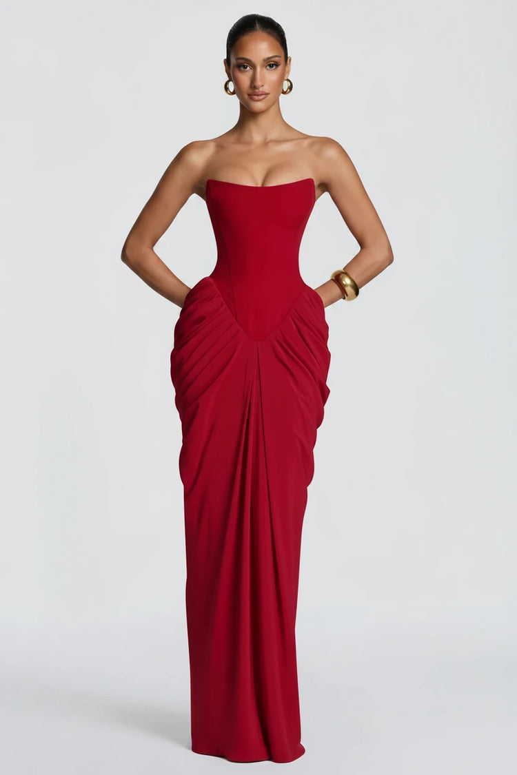 Yembi Fashion luxury red strapless maxi gown featuring a structured corset bodice and a dramatic draped basque waist skirt