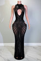 Yembi Fashion black rhinestone maxi dress with high neck, central chest keyhole cutout, sheer nude illusion mesh, and side hip cutouts