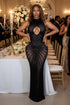 Yembi Fashion black rhinestone maxi dress with high neck, central chest keyhole cutout, sheer nude illusion mesh, and side hip cutouts
