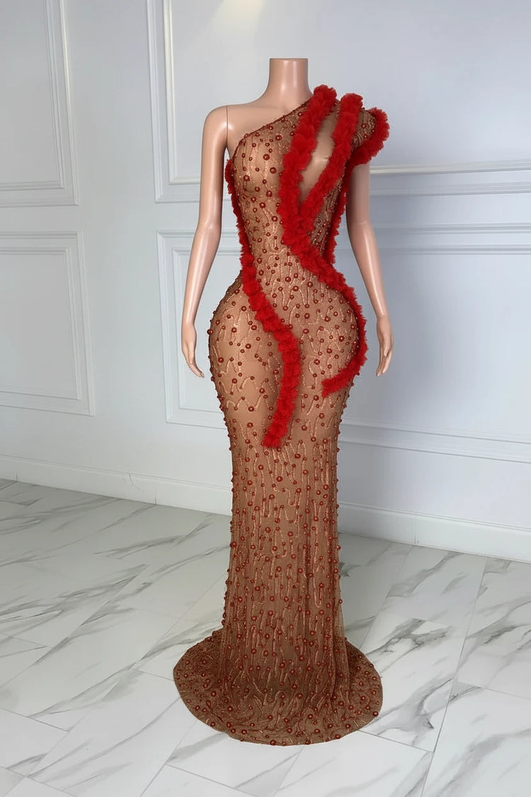 Yembi Fashion red rhinestone maxi dress with asymmetric one shoulder neckline, sheer nude illusion mesh, ruby crystals, and bold red ruffled fabric trim